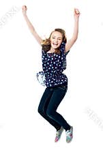 Young girl jumping in excitement