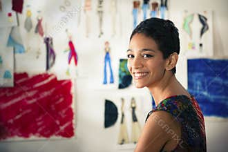 Hispanic young woman working as fashion designer