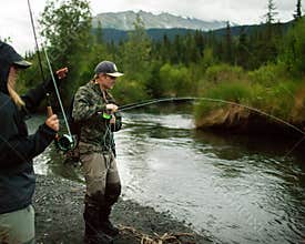 man catching fish alaska fly fishing