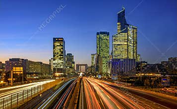 Modern Financial District Glow at Busy hours, after office at night in La Defense district, Paris