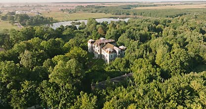 aerial panoramic view overlooking the old abandoned palace or historic buildings in forest