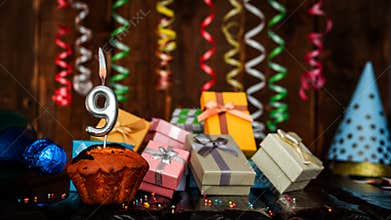 Birthday background with muffin and candles with number 9. Beautiful anniversary background with cake copy space with burning