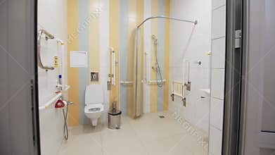 Bathroom equipped with bars for people with disability comfort