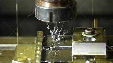 Closeup slow motion scene of the tapping process on machining center