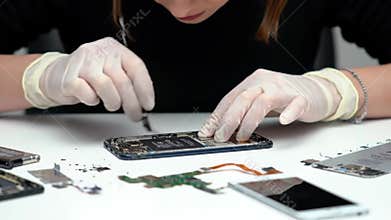 Mobile Phone Repair Close up Disassembly with White Gloves On Bright White Background