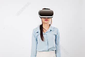 Young woman wearing vr glasses immersed in virtual reality technology tech
