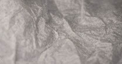 crumpled wrapping paper after prolonged use, thin paper made of cellulose