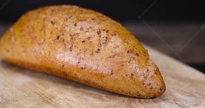 a healthy loaf of soft bread with added seeds and bran