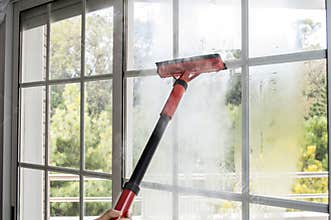 Cleaning window with steam