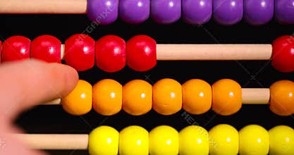 colorful wooden beads on abacus for children's play