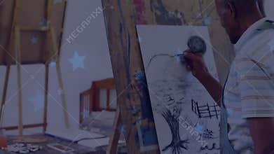 Artist lifting charcoal pencil sketching horizon line shading sun orb creating landscape in studio