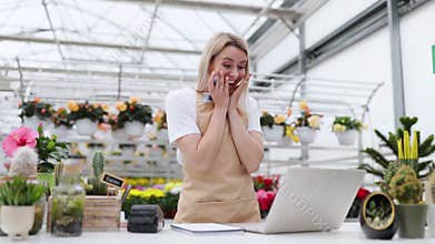 Excited Florist At Shop Counter