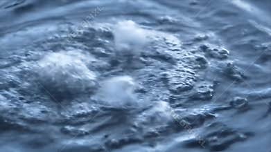 Abstract Water Vortex: Dynamic Blue Swirl, Bubbles Rising, Close-Up