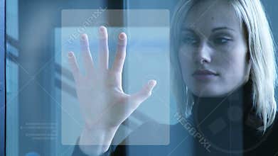 Businesswoman touching a security system