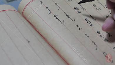 Close shot of Chinese manchu language Calligraphy writing