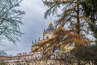 Historic architecture of a palace in a city park on a cloudy day during autumn season