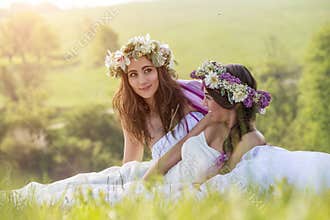 2 Beautiful bride in the outdoor, sitting on the grass - idyllic