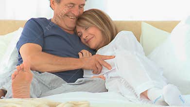 Cute elderly couple talking to each other