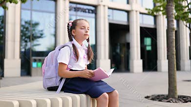 Girl with Backpack at School