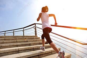 Healthy lifestyle woman legs running on stone stai
