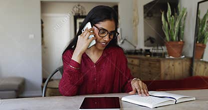 Young business woman leading phonecall by work-related matters
