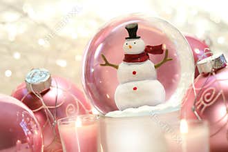 Snow globe with pink balls
