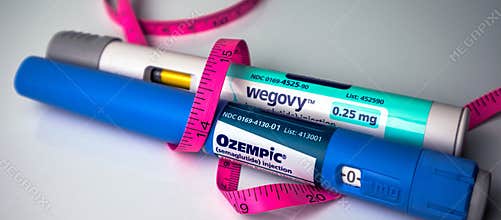 Ozempic and Wegovy Pens wrapped in measuring tape