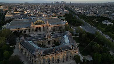 Drone shot of the Petit Palais and the Grand Palais des Champs-Elysees at sunrise in Paris, France