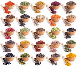 Collection of different spices and herbs isolated on white