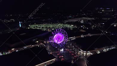 High drone footage of the Irvine Spectrum Center Giant Wheel at night in Irvine, California, USA