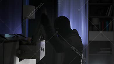 robbery, adult male in balaclava of dubious reputation rummaging through things late at night