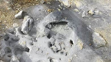 geothermal area Namafjall with mud pot fuming and boiling