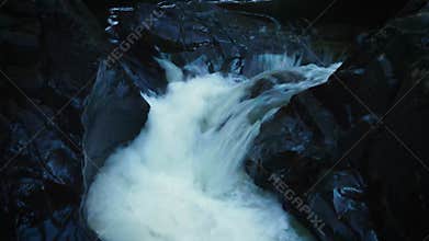 Drone shot of a rushing creek in the winter at Medicine bowls river, Courtenay, Vancouver Island