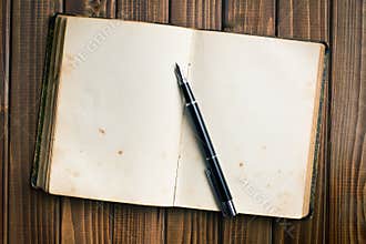 Open book with fountain pen