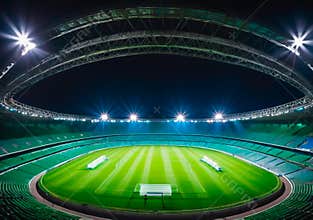 Modern Football Stadium with Dramatic Spotlighting at Night, Competition and Championship Concepts