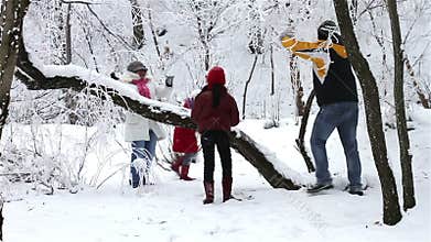 Family Having Snowball Fight