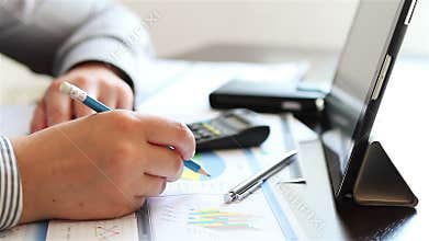 Businesswoman hands working with charts on tablet computer