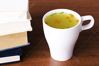 Hot vegetable soup in a cup.