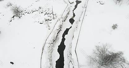 Aerial of rapids in winter.