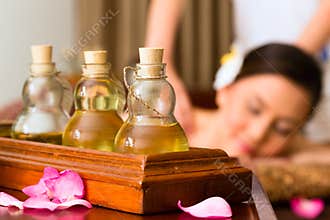 Chinese Woman at wellness massage with essential oils