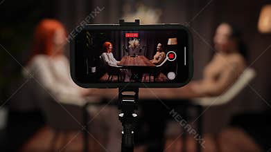 Two Influencers of women being interviewed in a loft-style podcast studio