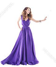 Woman showing advertisement in purple silk dress over white background