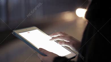 Woman using touchpad in the underground
