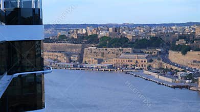 Cruise Ship Arriving at Port with Historic Fortifications in Valletta, Malta