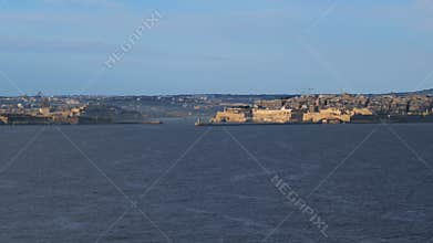 Slow-motion approach to Valletta, Malta, with historic fortifications and harbor
