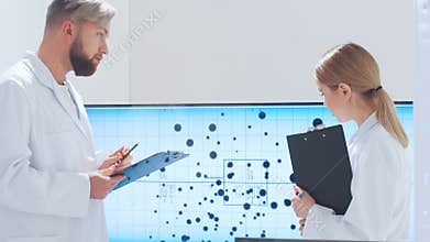 Scientific laboratory filled with various research equipment. Scientists are conducting experiments and research. Science and