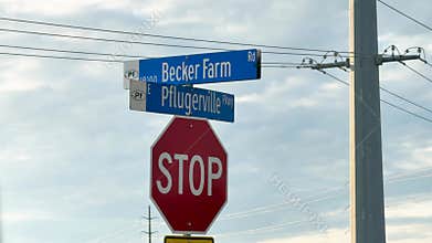 Video shows a red stop sign and blue street sign at Becker Farm