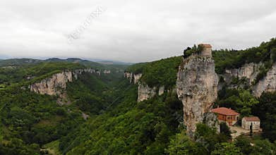 Drone aerial of Katskhi Pillar limestone monolith with Orthodox monastery on top in Chiatura, Georgia. Unique spiritual site of