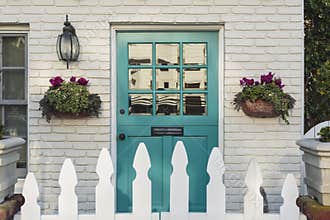 Teal front door of a classic home