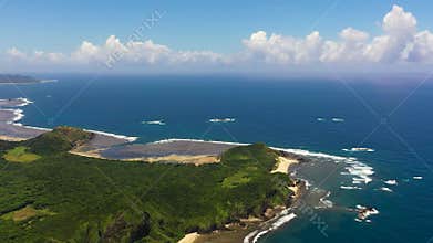 A tropical island and the sea.